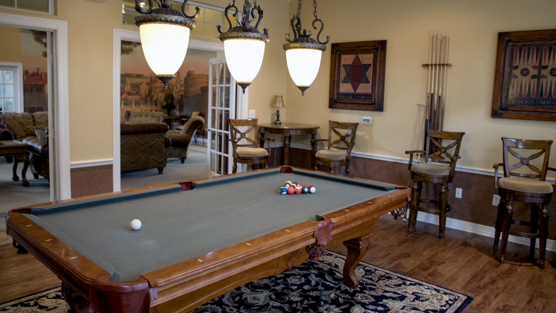 Interior shot of pool room with a game set and ready to begin